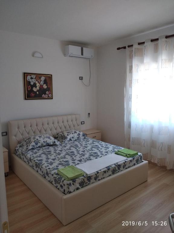 Postel nebo postele na pokoji v ubytování Casa Prifti