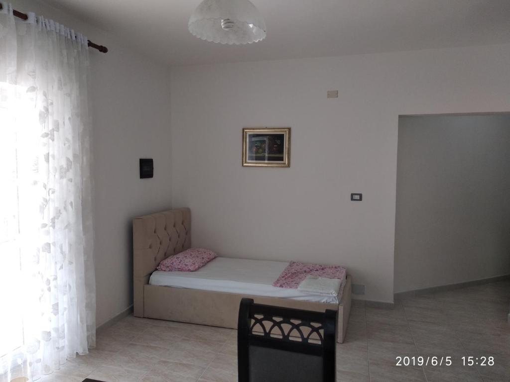 Postel nebo postele na pokoji v ubytování Casa Prifti