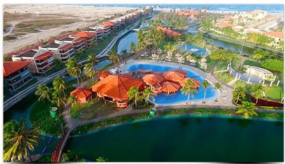 an aerial view of a resort with a swimming pool at Aquaville Térreo - Porto das Dunas - CEARÁ - AV80101 in Aquiraz