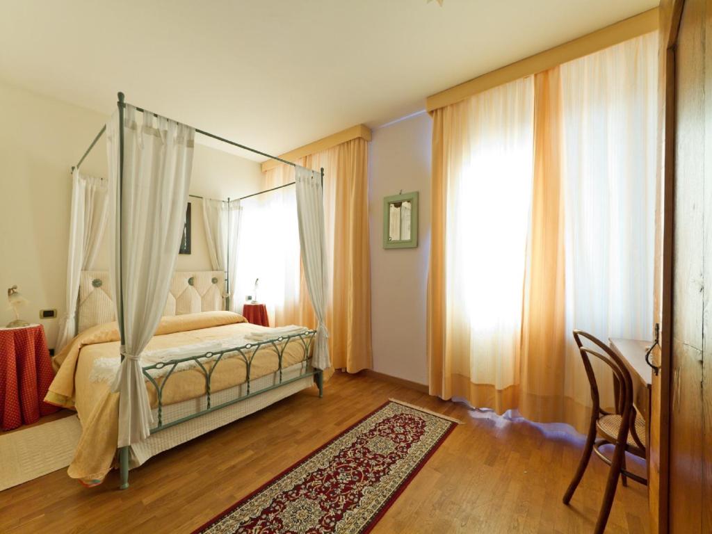 Postel nebo postele na pokoji v ubytování Villa Butussi - L'ospitalità del Vino