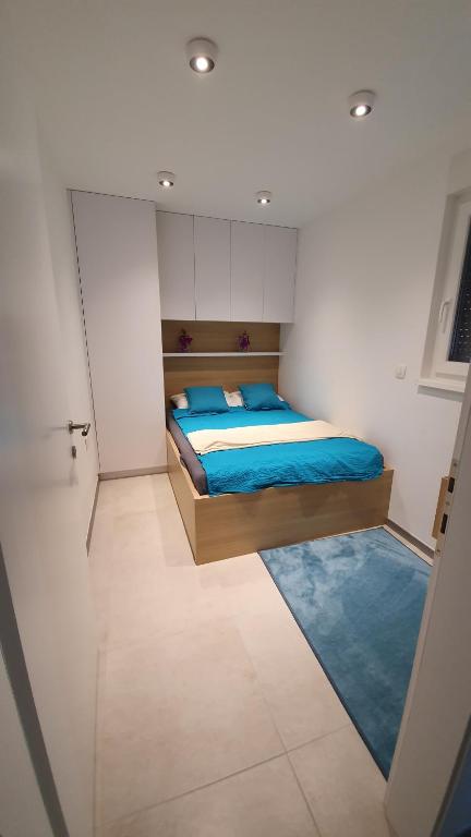 Ein Bett oder Betten in einem Zimmer der Unterkunft Apartman Mateo