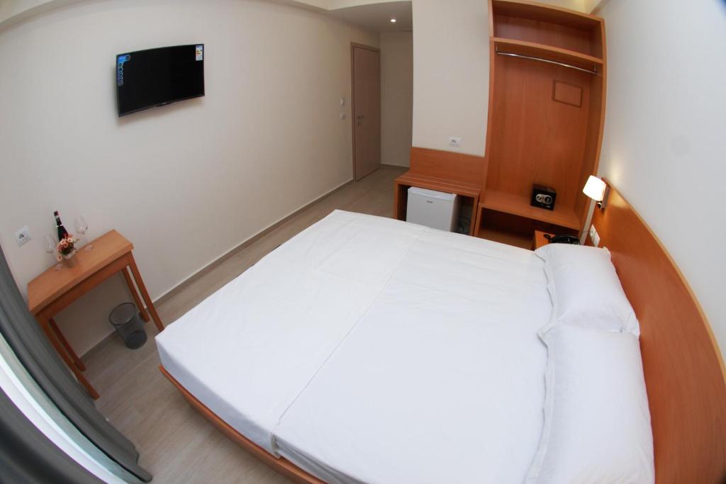 Postel nebo postele na pokoji v ubytování Hotel Ari 2