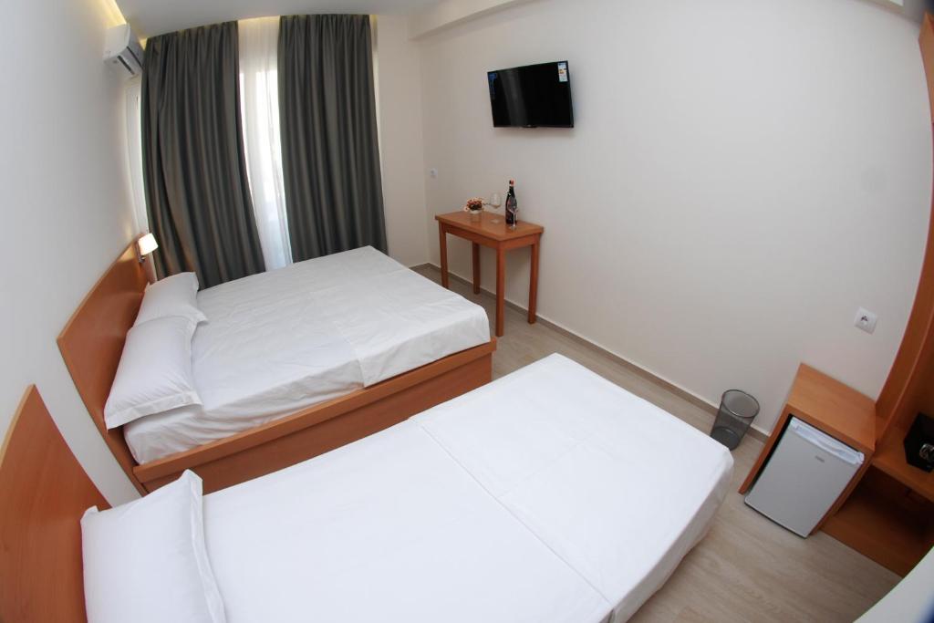Postel nebo postele na pokoji v ubytování Hotel Ari 2
