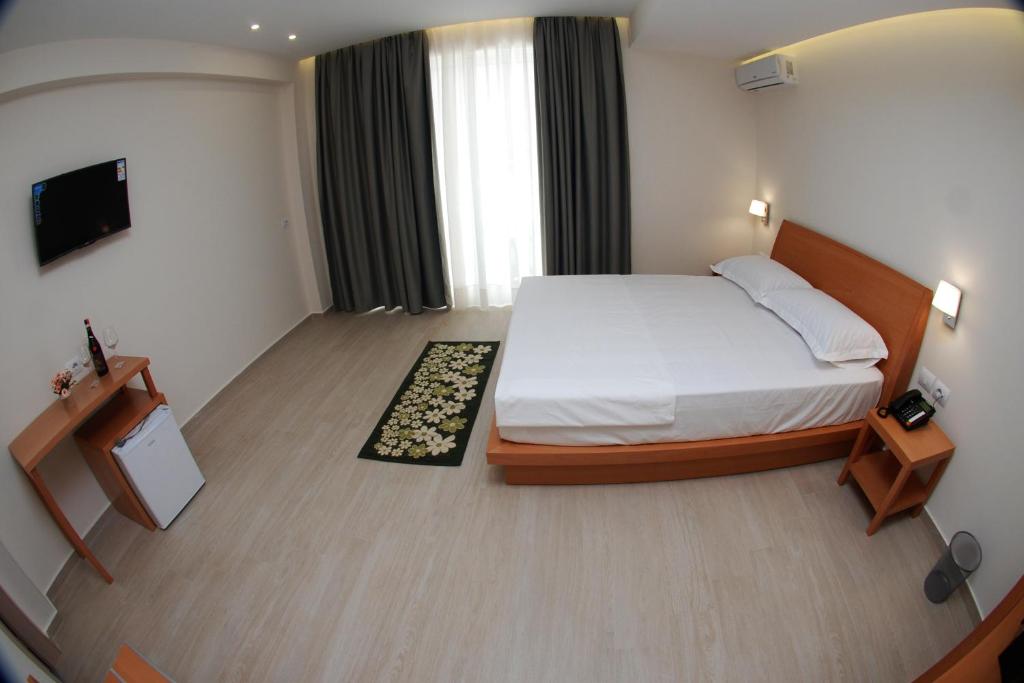 Postel nebo postele na pokoji v ubytování Hotel Ari 2