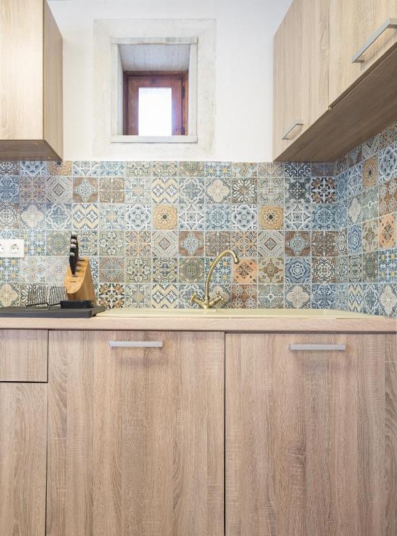 Kuchyň nebo kuchyňský kout v ubytování Syros village suites