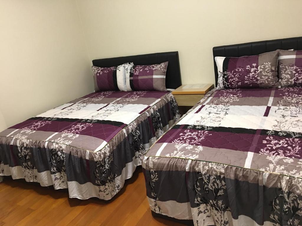 Postel nebo postele na pokoji v ubytování Hong Guo Homestay