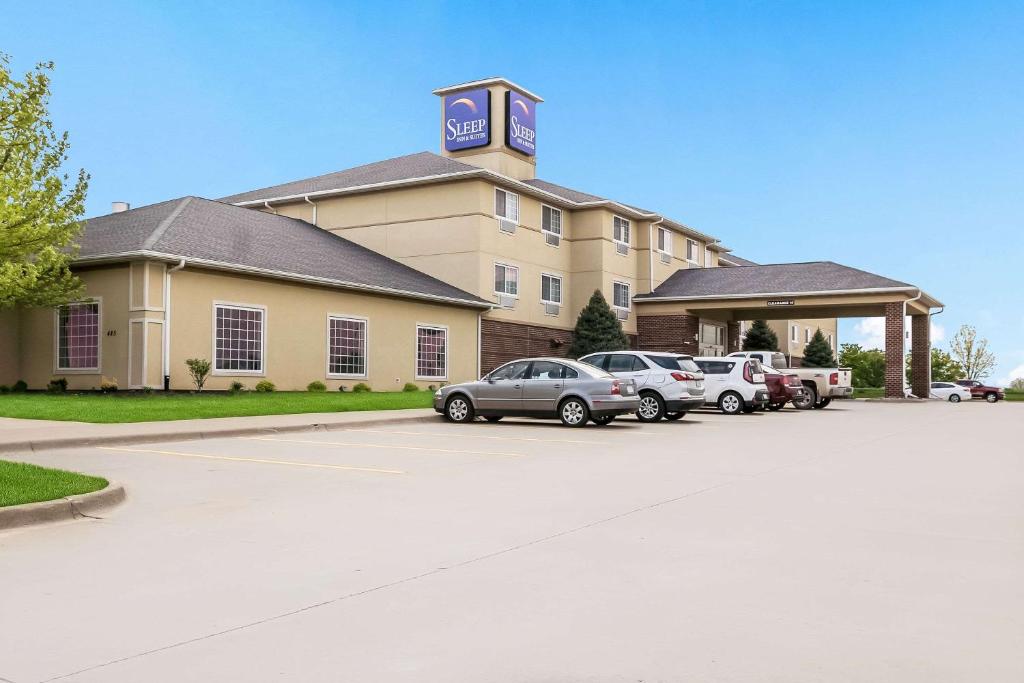 a building with cars parked in a parking lot at Sleep Inn North Liberty/Coralville in North Liberty