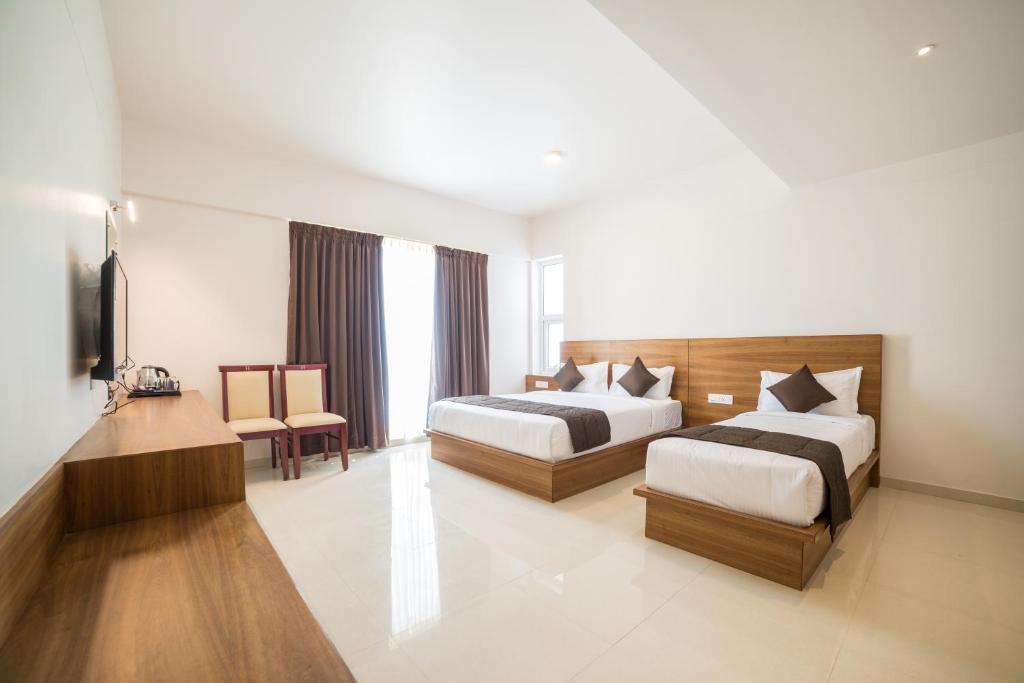 Postel nebo postele na pokoji v ubytování Heritage Inn