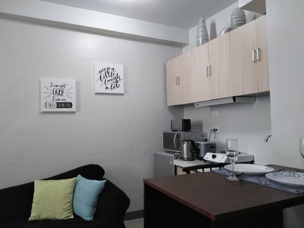 Kuchyň nebo kuchyňský kout v ubytování Mak'z Condo Place