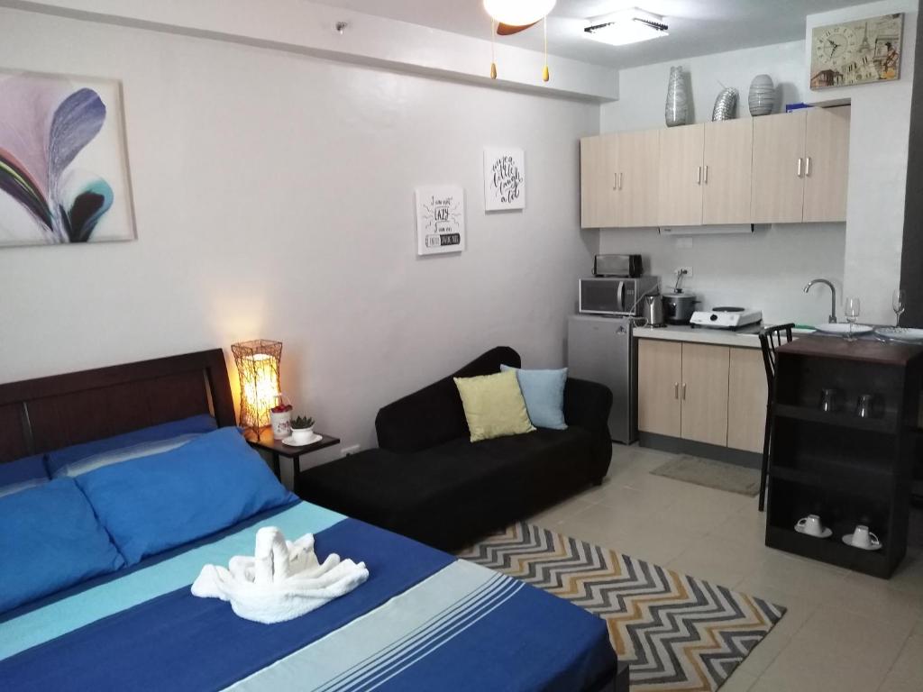 Kuchyň nebo kuchyňský kout v ubytování Mak'z Condo Place