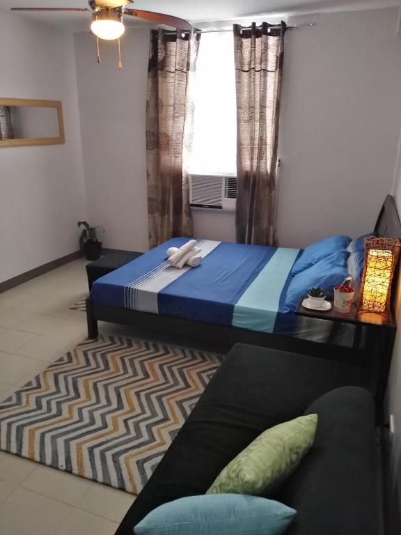 Postel nebo postele na pokoji v ubytování Mak'z Condo Place