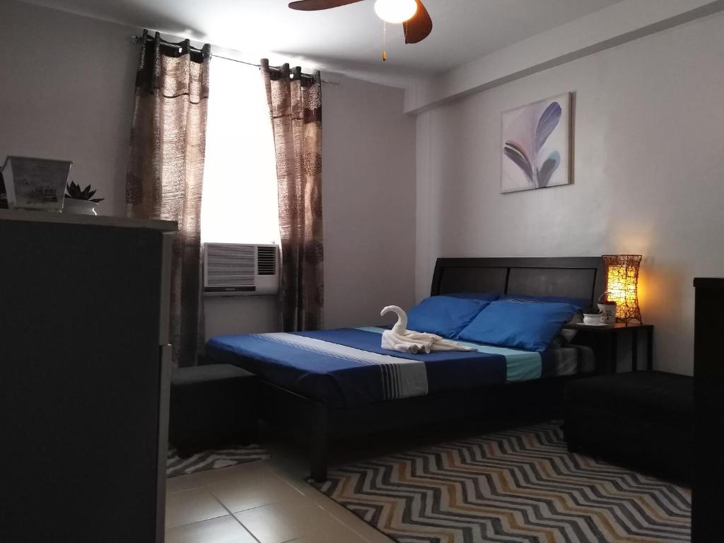 Postel nebo postele na pokoji v ubytování Mak'z Condo Place
