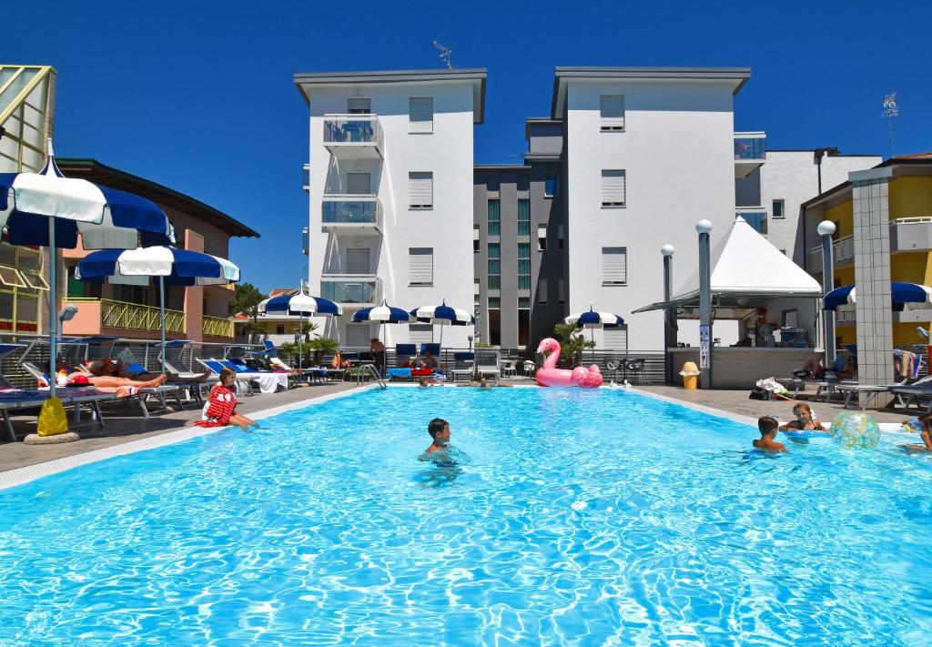 a group of people in a swimming pool at Hotel Bristol in Caorle