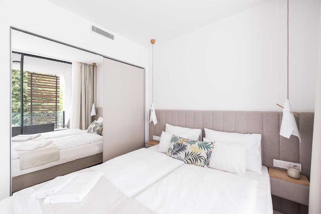 Postel nebo postele na pokoji v ubytování OliverLux Aparthotel