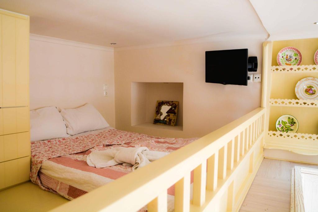 A bed or beds in a room at Kleio House