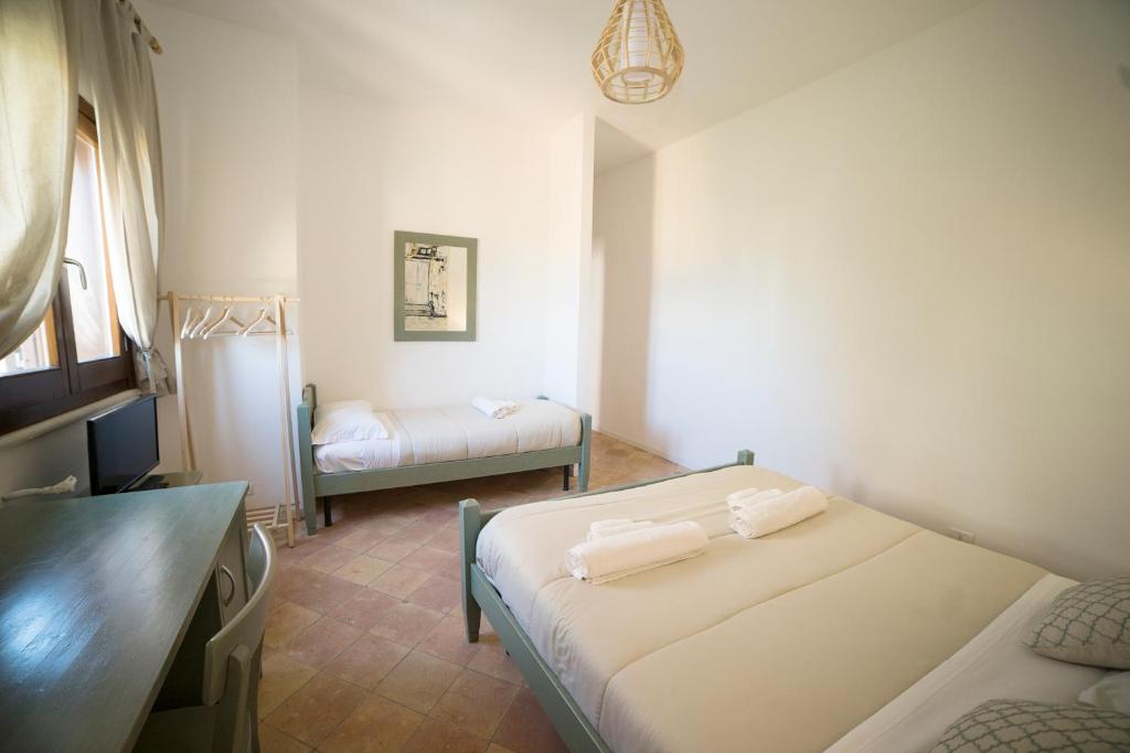Postel nebo postele na pokoji v ubytování Maremosso