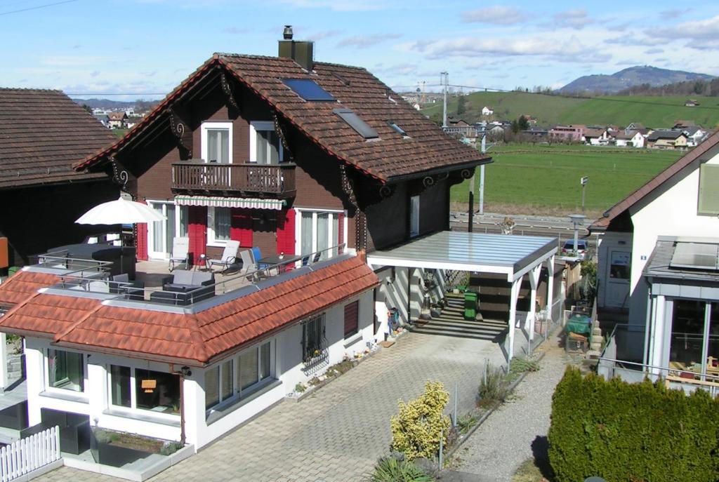 an overhead view of a house with a roof at Pension Chalet Charme in Siebnen