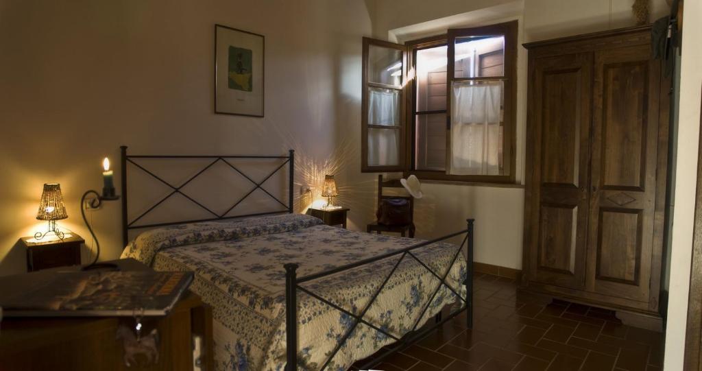 Posteľ alebo postele v izbe v ubytovaní Bio Agriturismo Il Melograno di Banditella Ristorante