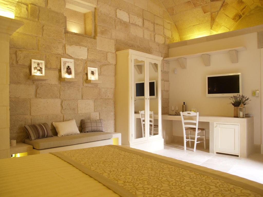 Posteľ alebo postele v izbe v ubytovaní Corte Dei Granai Meeting & SPA - Raro Rooms Collection