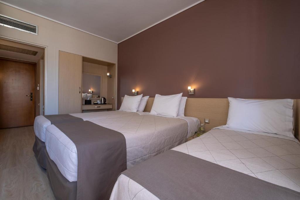 Postel nebo postele na pokoji v ubytování Acropolis View Hotel