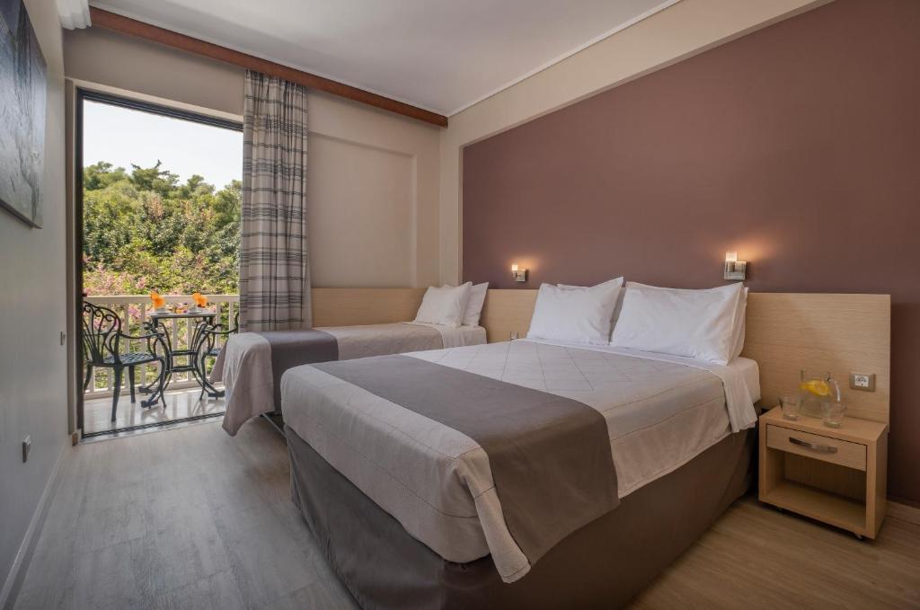 Postel nebo postele na pokoji v ubytování Acropolis View Hotel