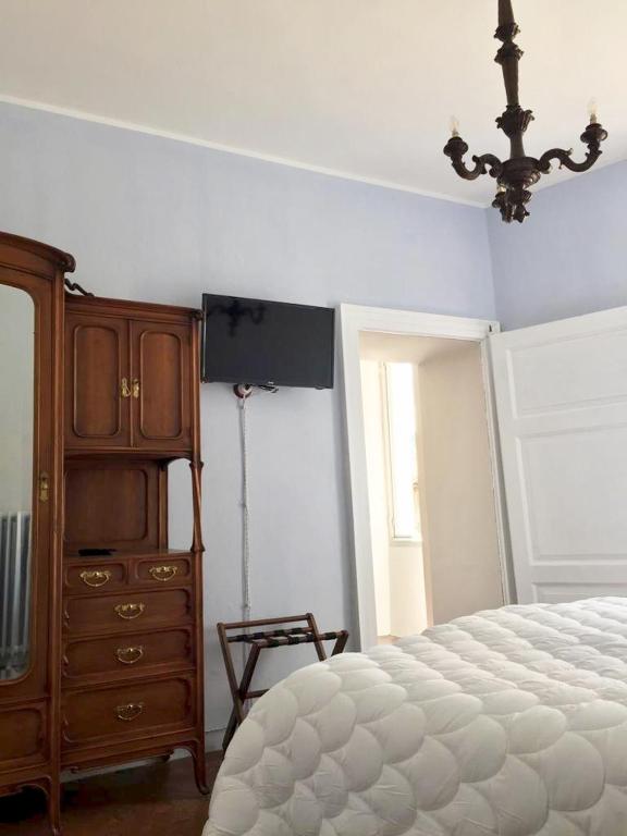 Postel nebo postele na pokoji v ubytování B&B Villa Rosalinda