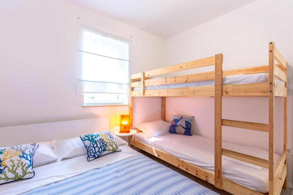Postel nebo postele na pokoji v ubytování Apartments Selce