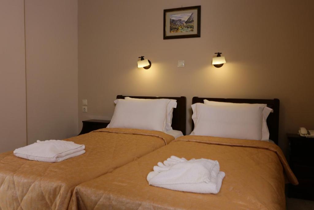 Postel nebo postele na pokoji v ubytování Hotel Aktaion
