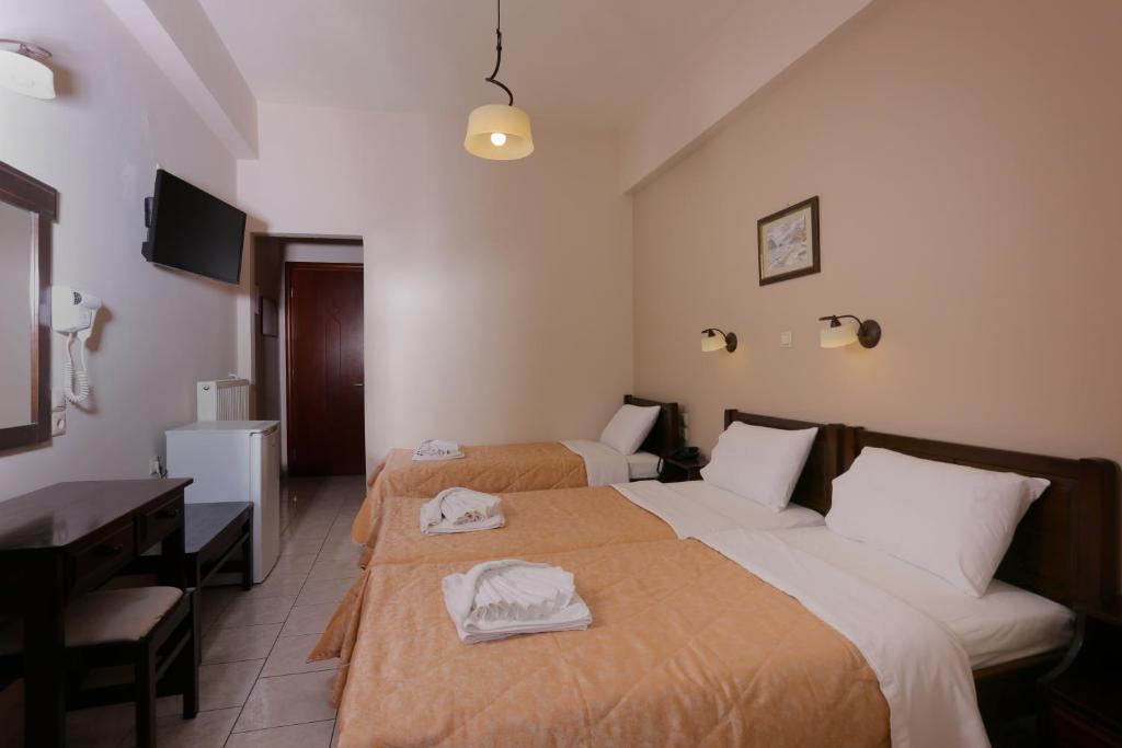 Postel nebo postele na pokoji v ubytování Hotel Aktaion