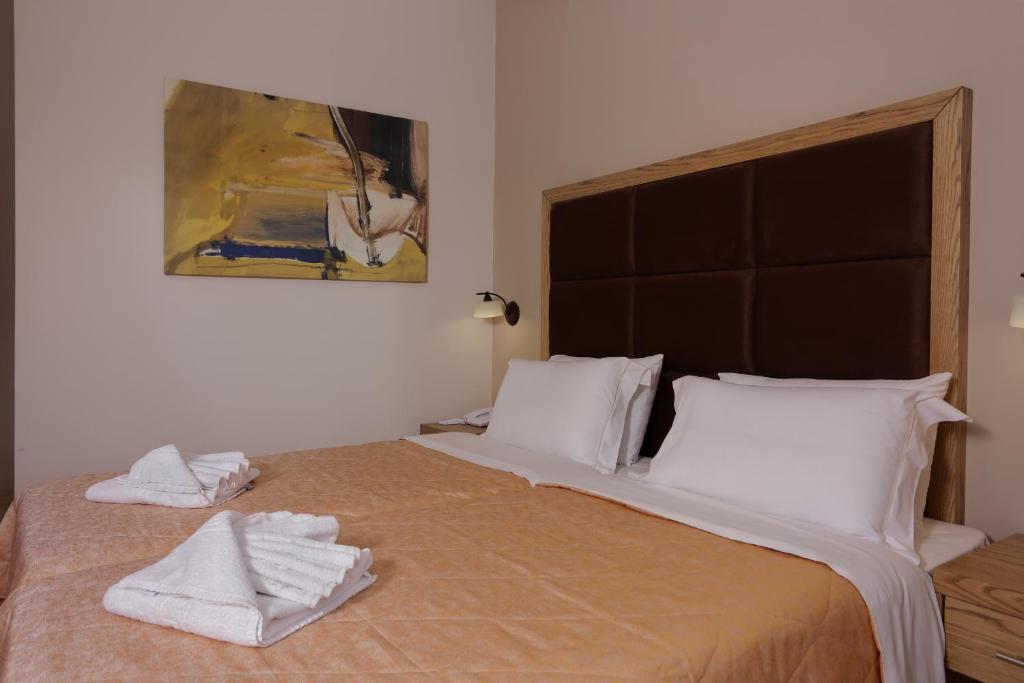 Postel nebo postele na pokoji v ubytování Hotel Aktaion