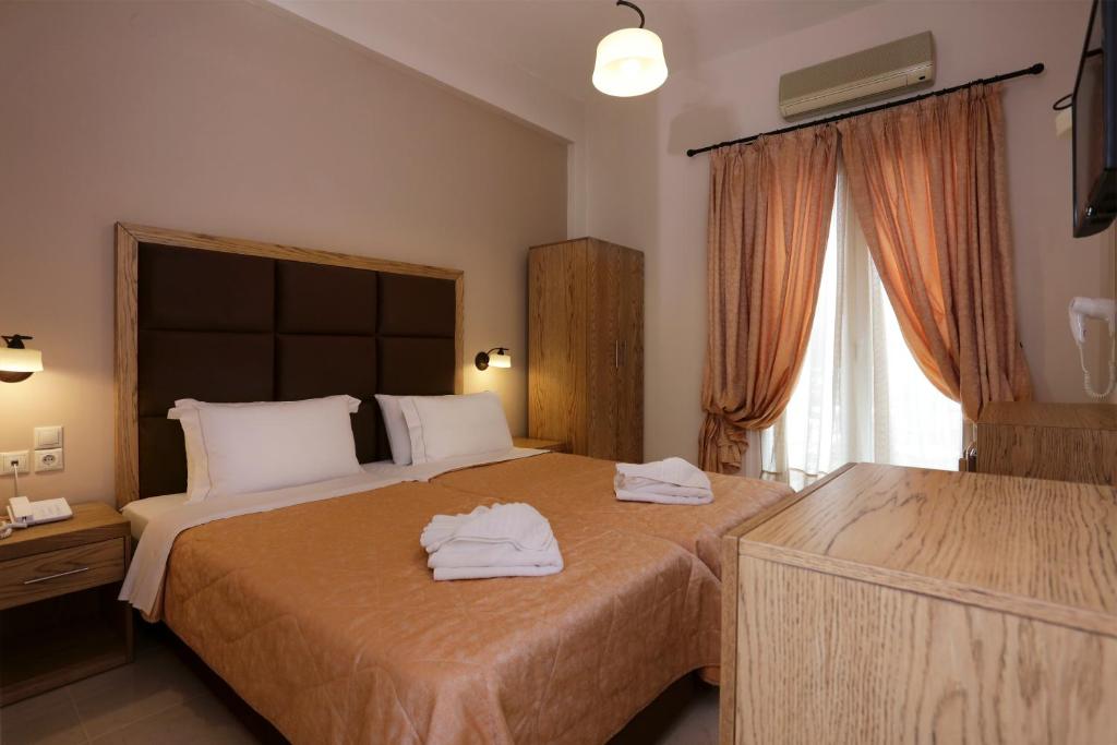 Postel nebo postele na pokoji v ubytování Hotel Aktaion