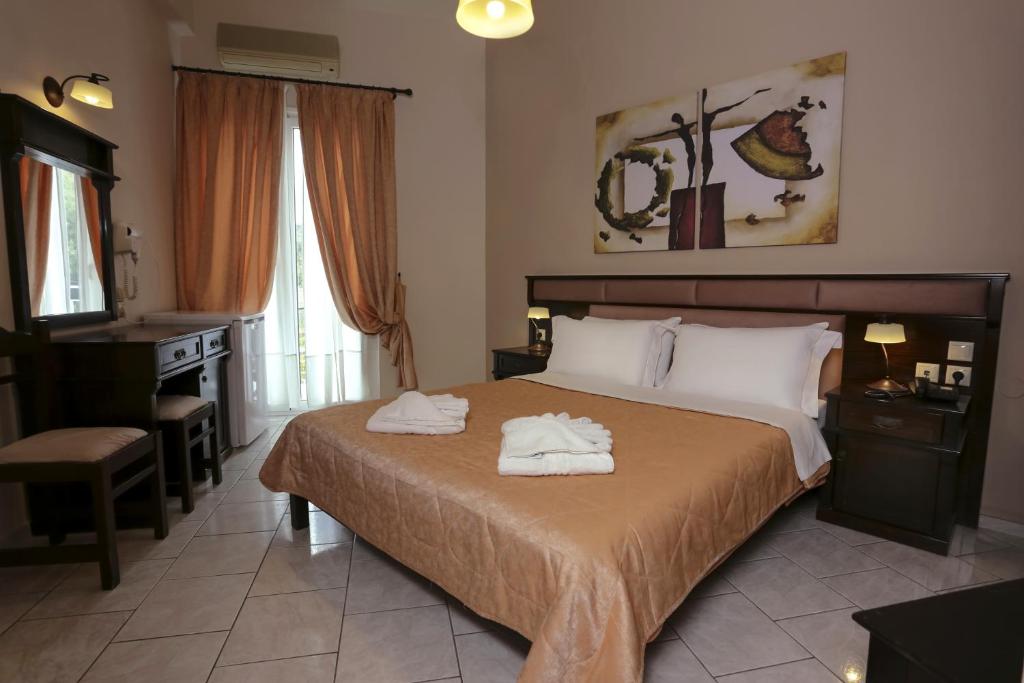 Postel nebo postele na pokoji v ubytování Hotel Aktaion