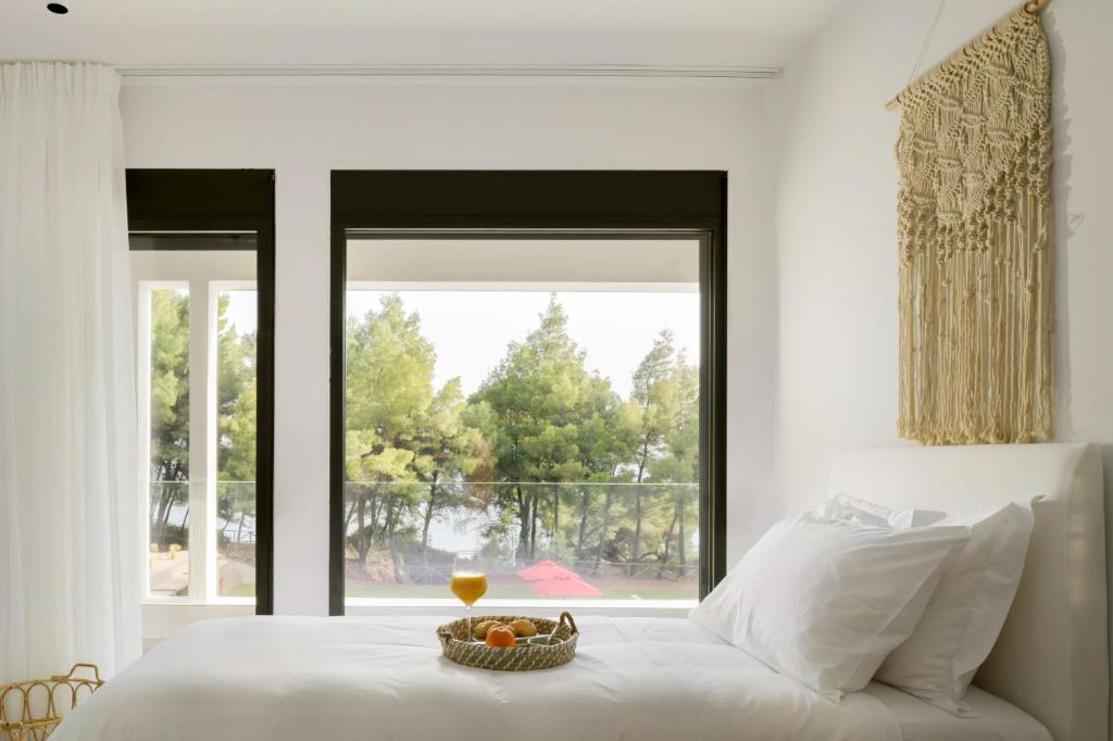 Postel nebo postele na pokoji v ubytování Amantes Villas and Suites