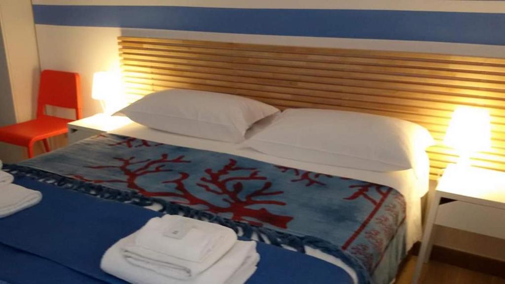 Postel nebo postele na pokoji v ubytování Parfumerie 5 Terre