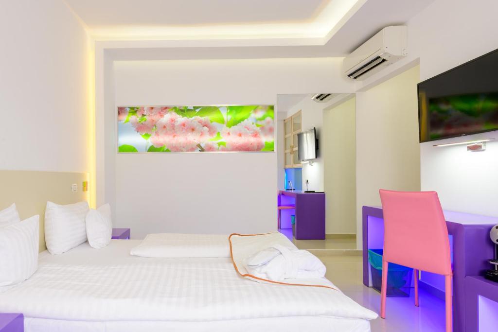 Postel nebo postele na pokoji v ubytování Hotel Christina Plus