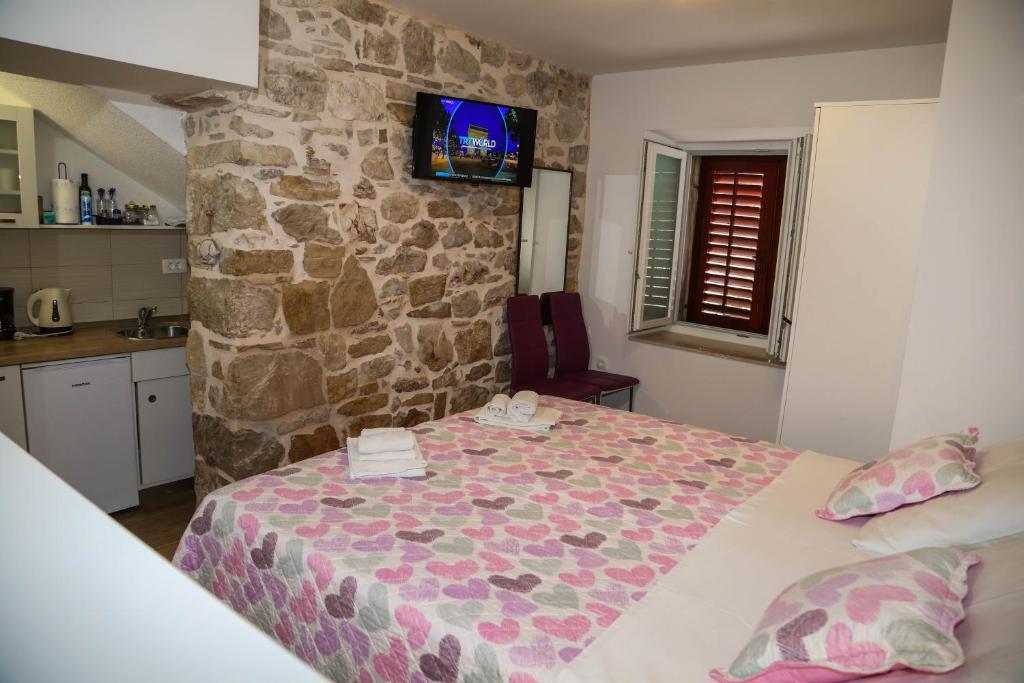 Postel nebo postele na pokoji v ubytování Apartments Seka