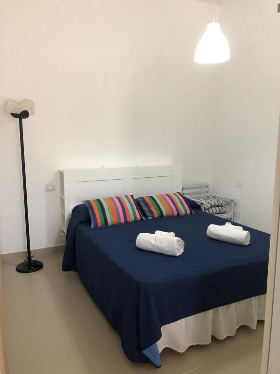 Postel nebo postele na pokoji v ubytování All'ombra del Carrubo - Metaponto