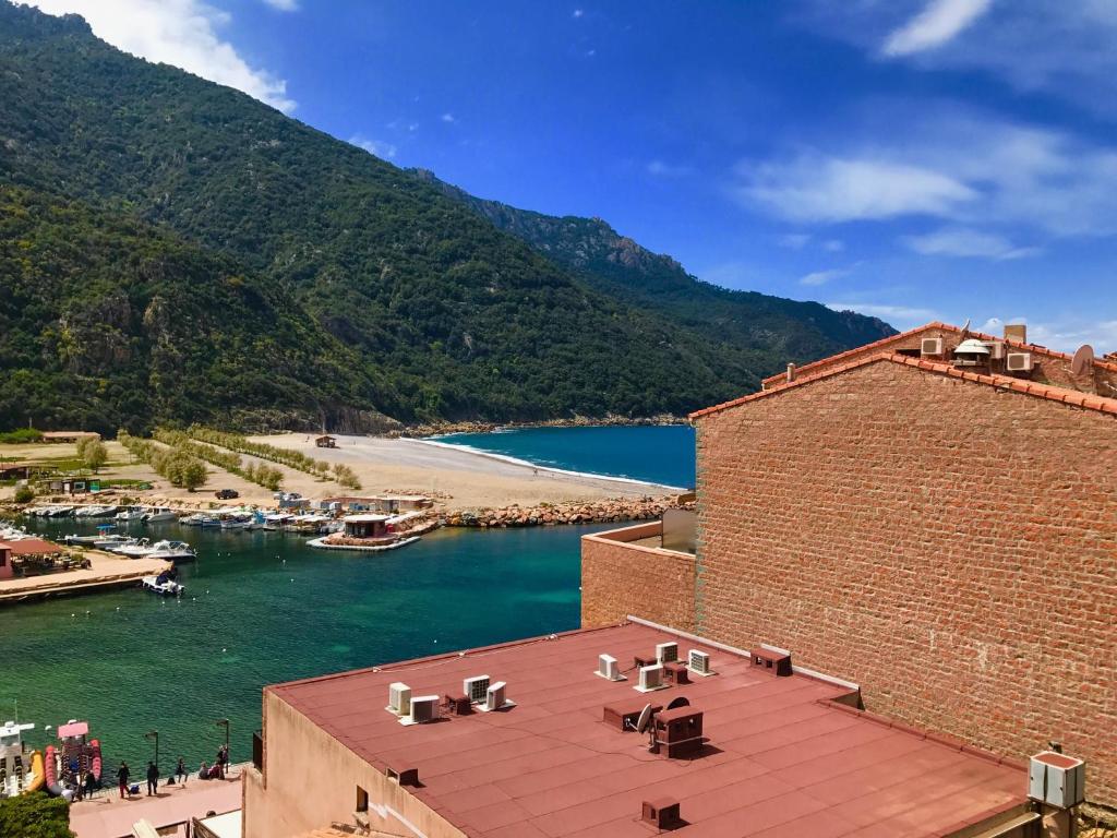 a view of a body of water from a building at Les résidences du port appartements meublés in Porto Ota