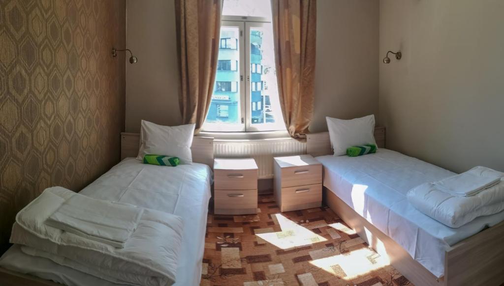 Postel nebo postele na pokoji v ubytování Villa Kadriorg Hostel