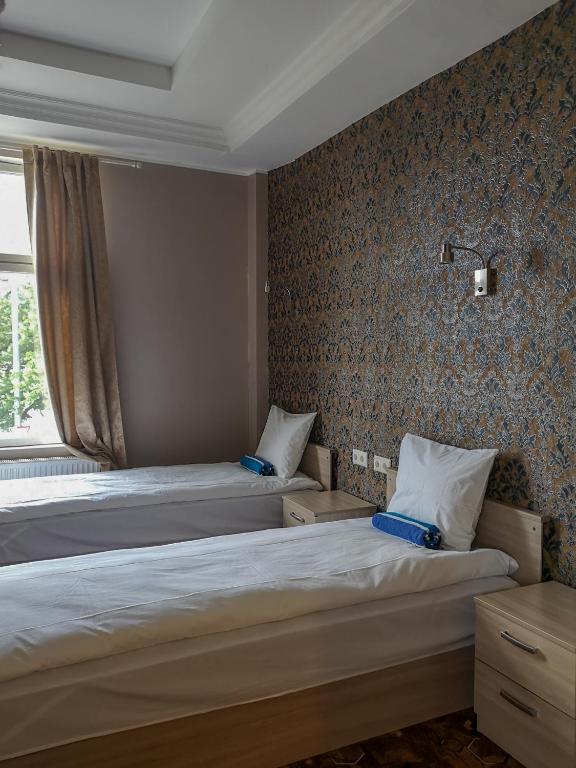 Postel nebo postele na pokoji v ubytování Villa Kadriorg Hostel