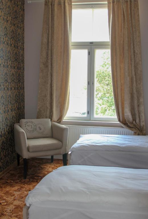 Postel nebo postele na pokoji v ubytování Villa Kadriorg Hostel