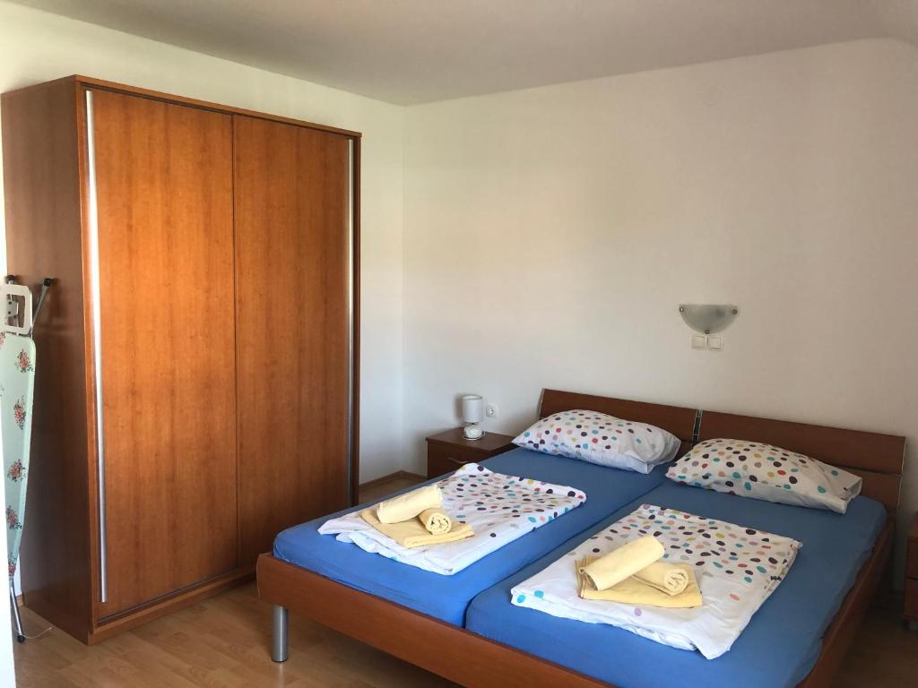 Postel nebo postele na pokoji v ubytování Apartment Laura
