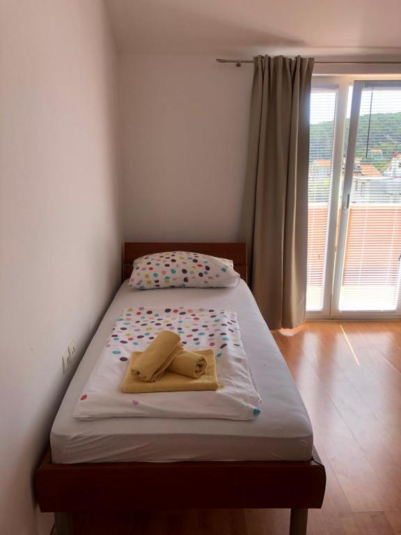 Postel nebo postele na pokoji v ubytování Apartment Laura