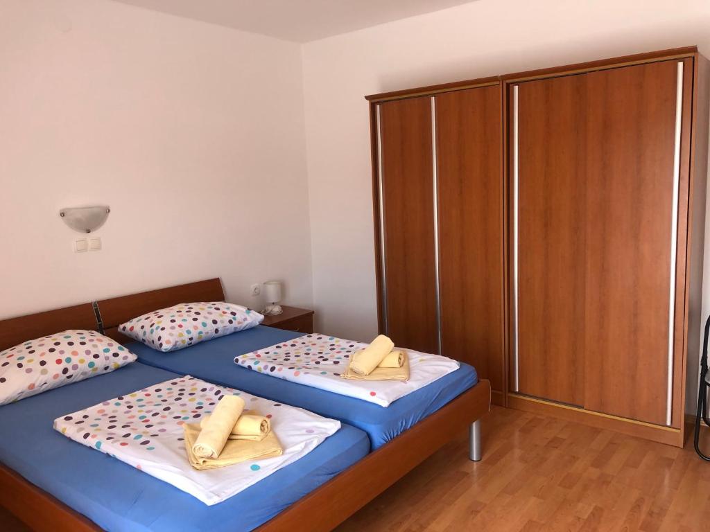 Postel nebo postele na pokoji v ubytování Apartment Laura