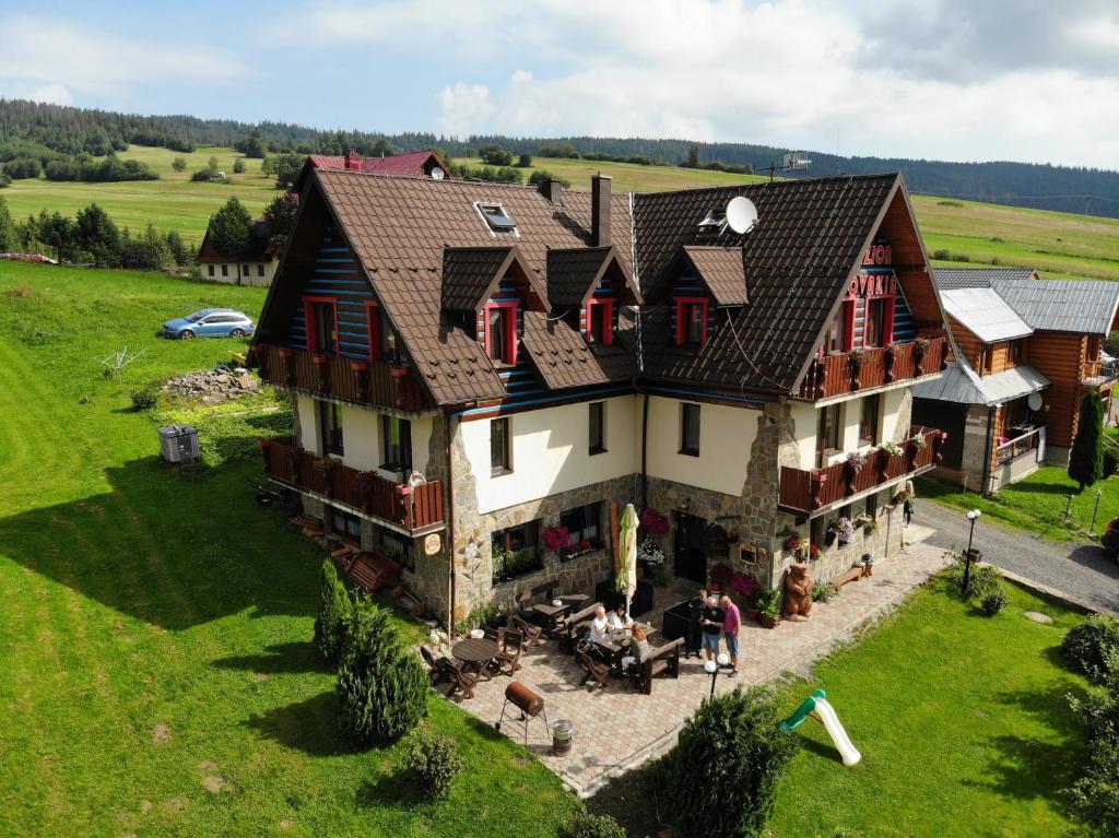 an aerial view of a large house in a field at Penzion Slovakia in Ždiar