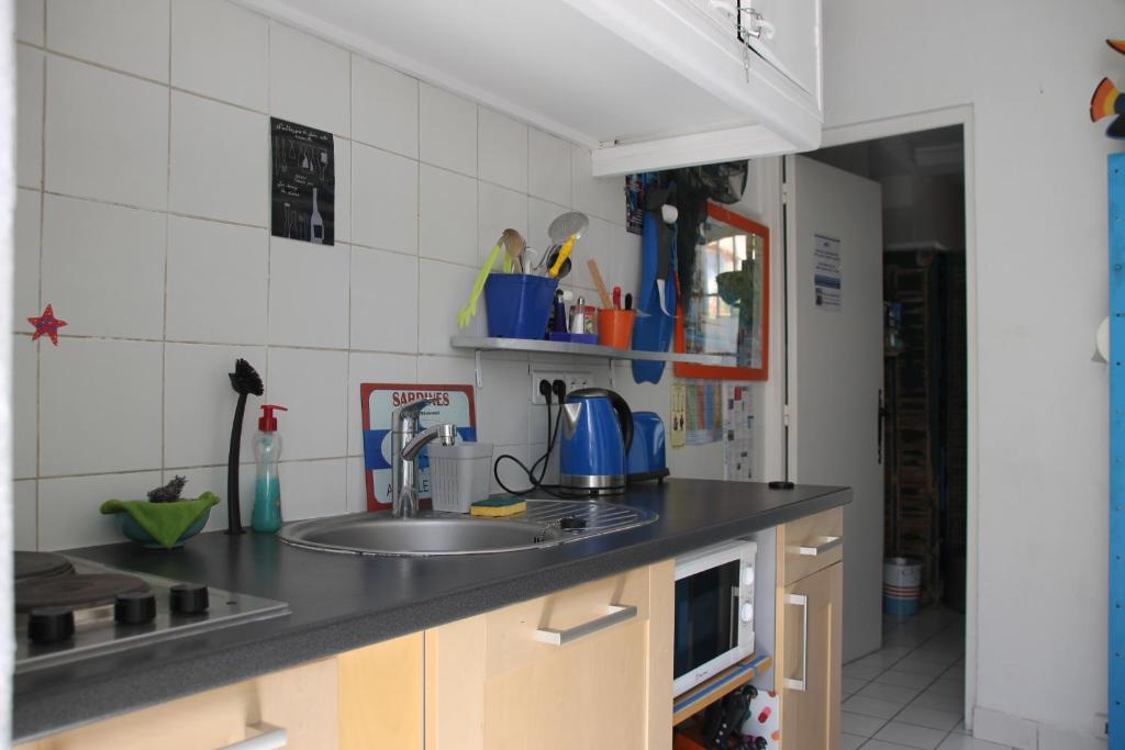Kuchyň nebo kuchyňský kout v ubytování Au Petit chez Soi