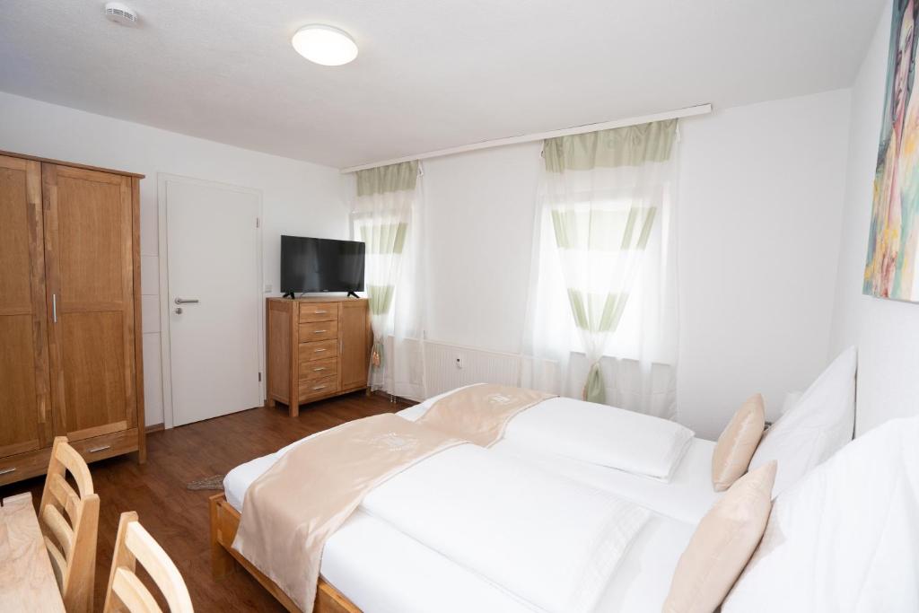 Postel nebo postele na pokoji v ubytování Bären