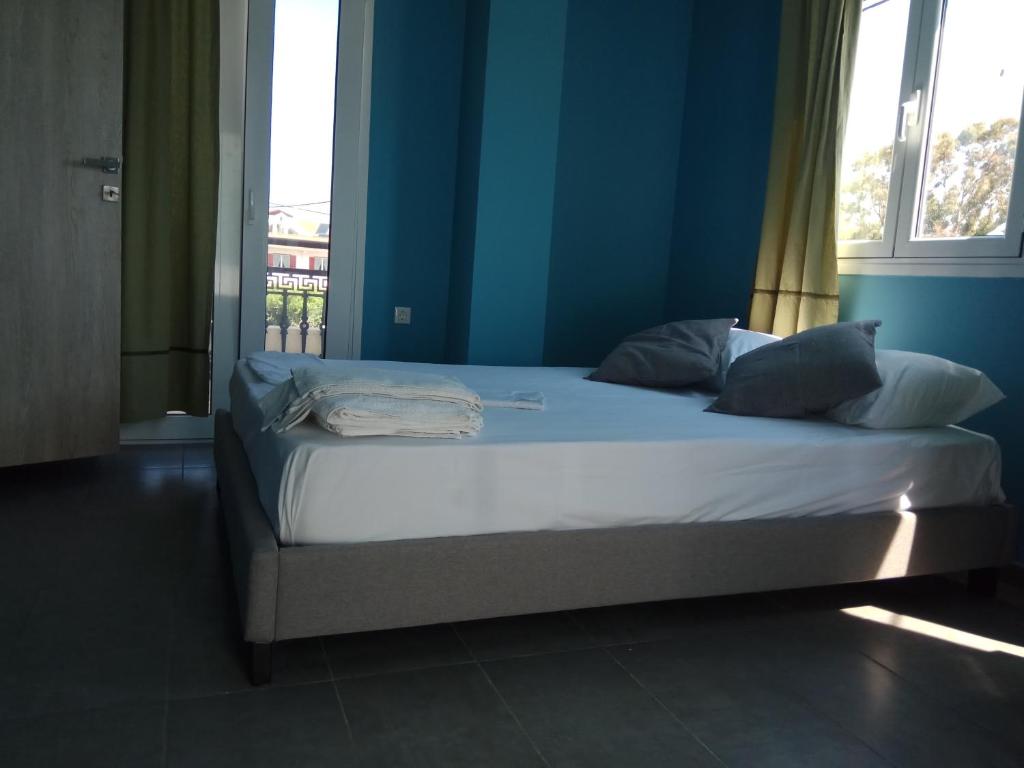 Postel nebo postele na pokoji v ubytování Monte Blu Holiday Apartment