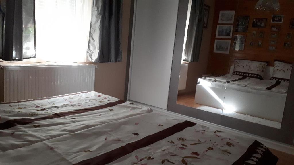 Postel nebo postele na pokoji v ubytování Fehér Rózsa Apartman