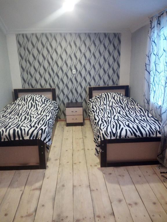 Кровать или кровати в номере Guesthouse MAMUKA zhabesh